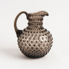 Hobnail Glass Pitcher in Smoky Amaro on a white background at Addison West