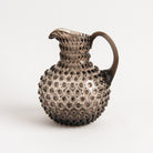 Hobnail Glass Pitcher in Smoky Amaro on a white background at Addison West