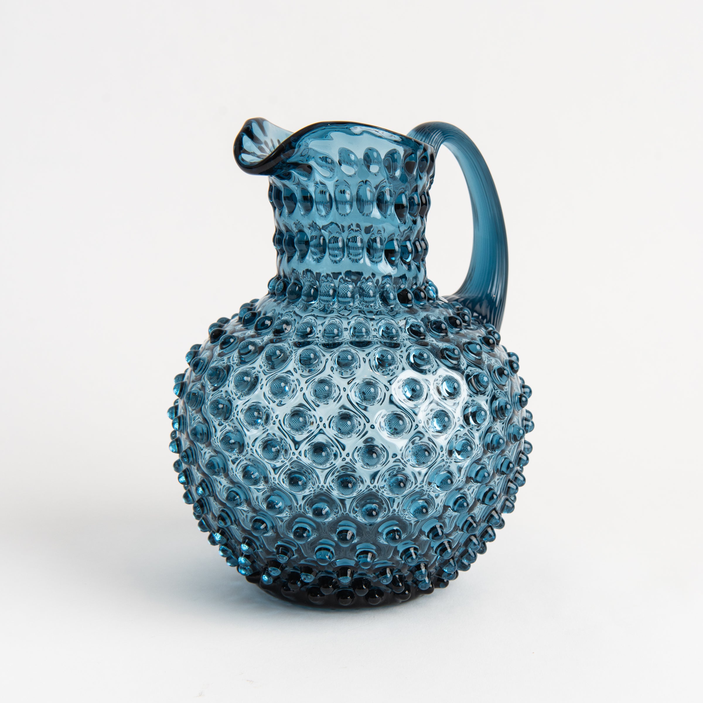 Hobnail Glass Pitcher in Midnight Blue on a white background at Addison West