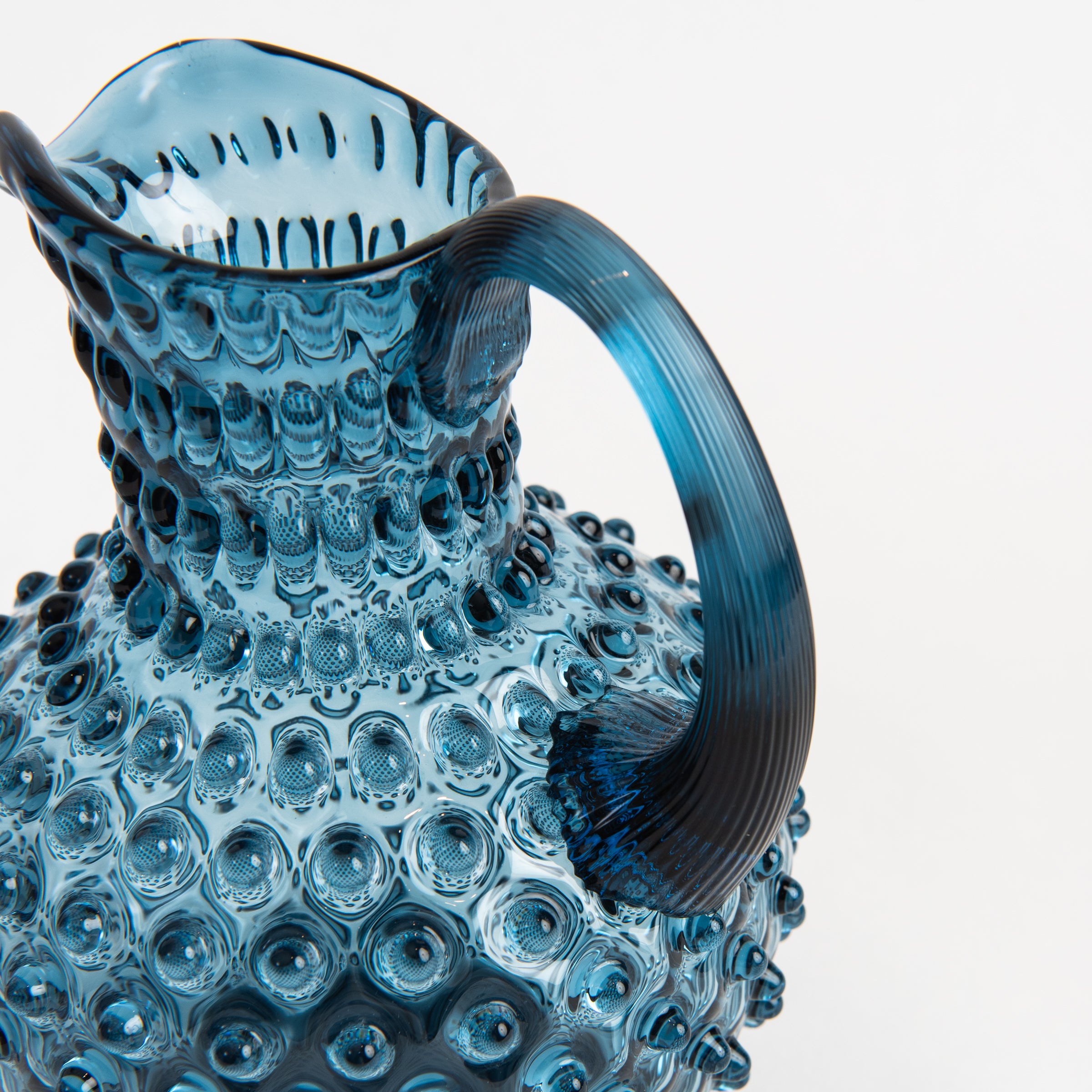 Hobnail Glass Pitcher in Midnight Blue on a white background at Addison West