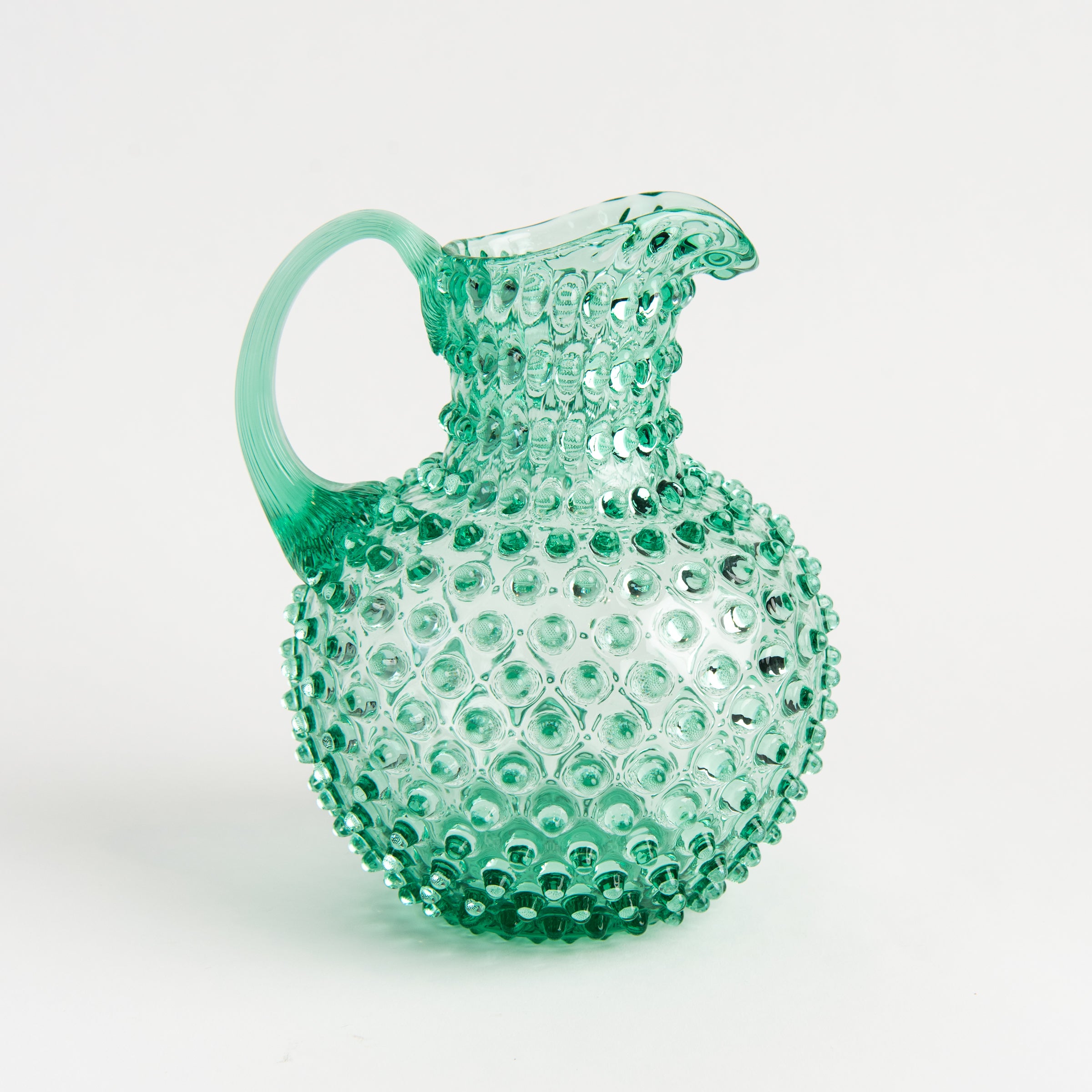 Hobnail Glass Pitcher in Capri Sea on a white background at Addison West