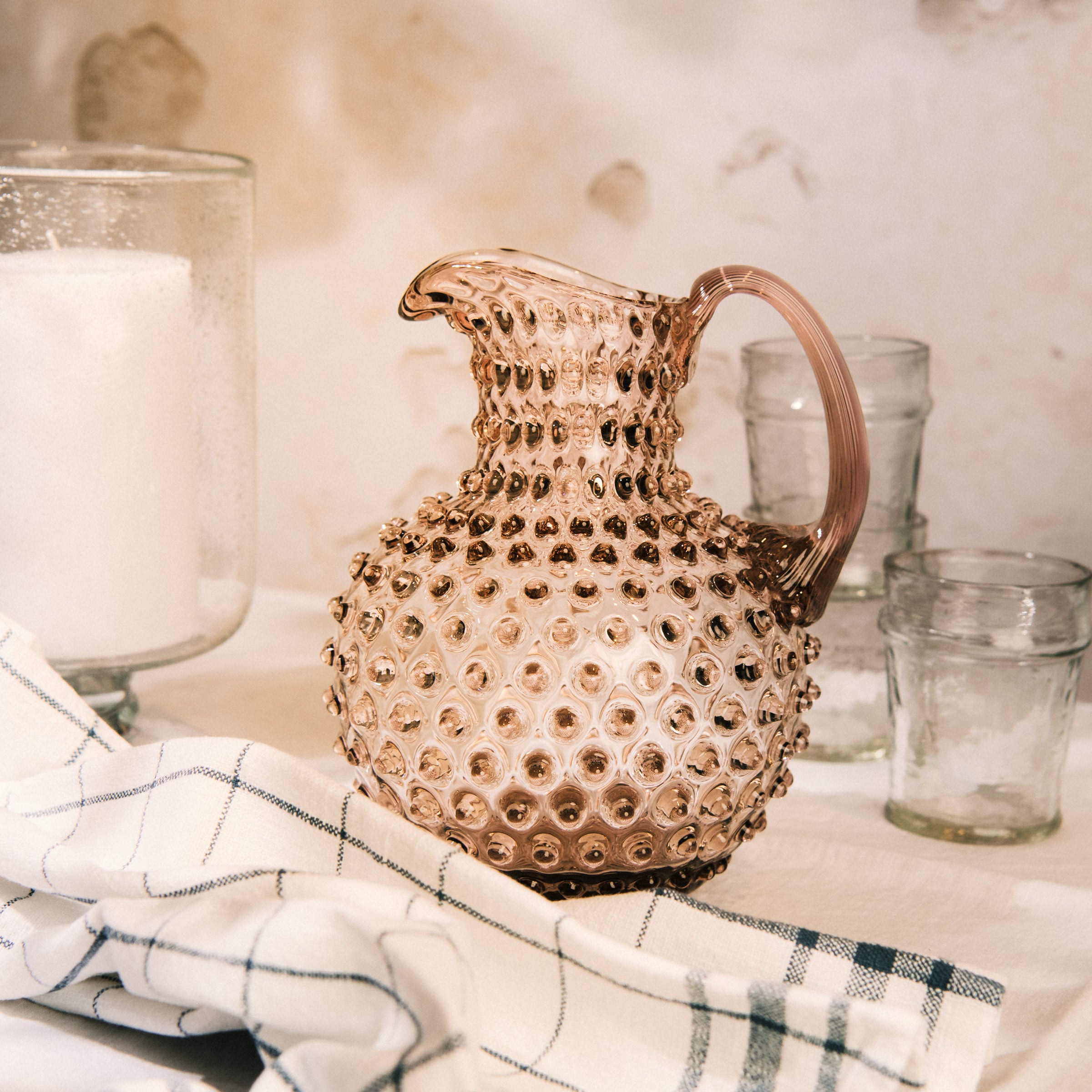Hobnail Glass Pitcher in Night Iris on a table at Addison West