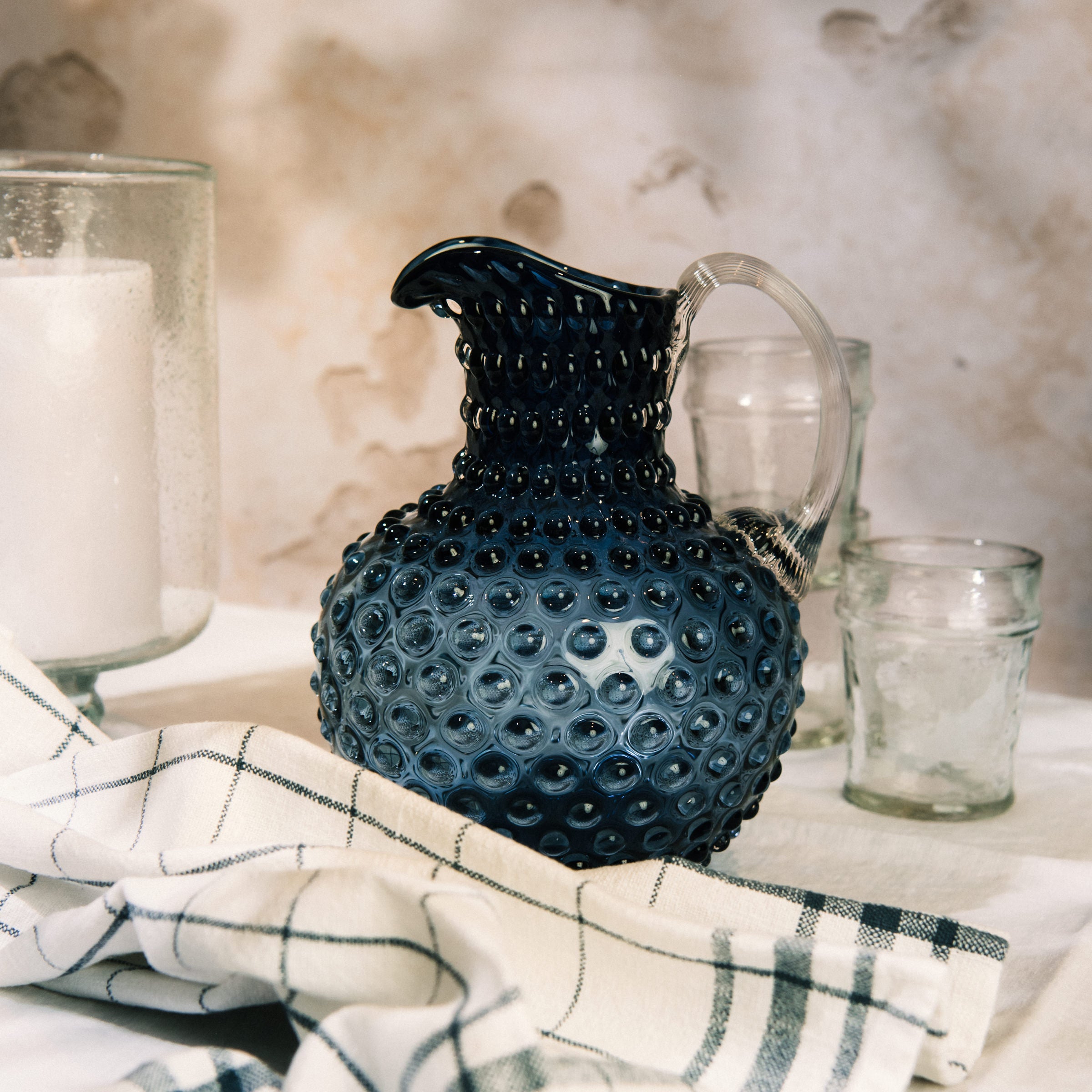 Hobnail Glass Pitcher in Atlantic Blue on a table at Addison West 