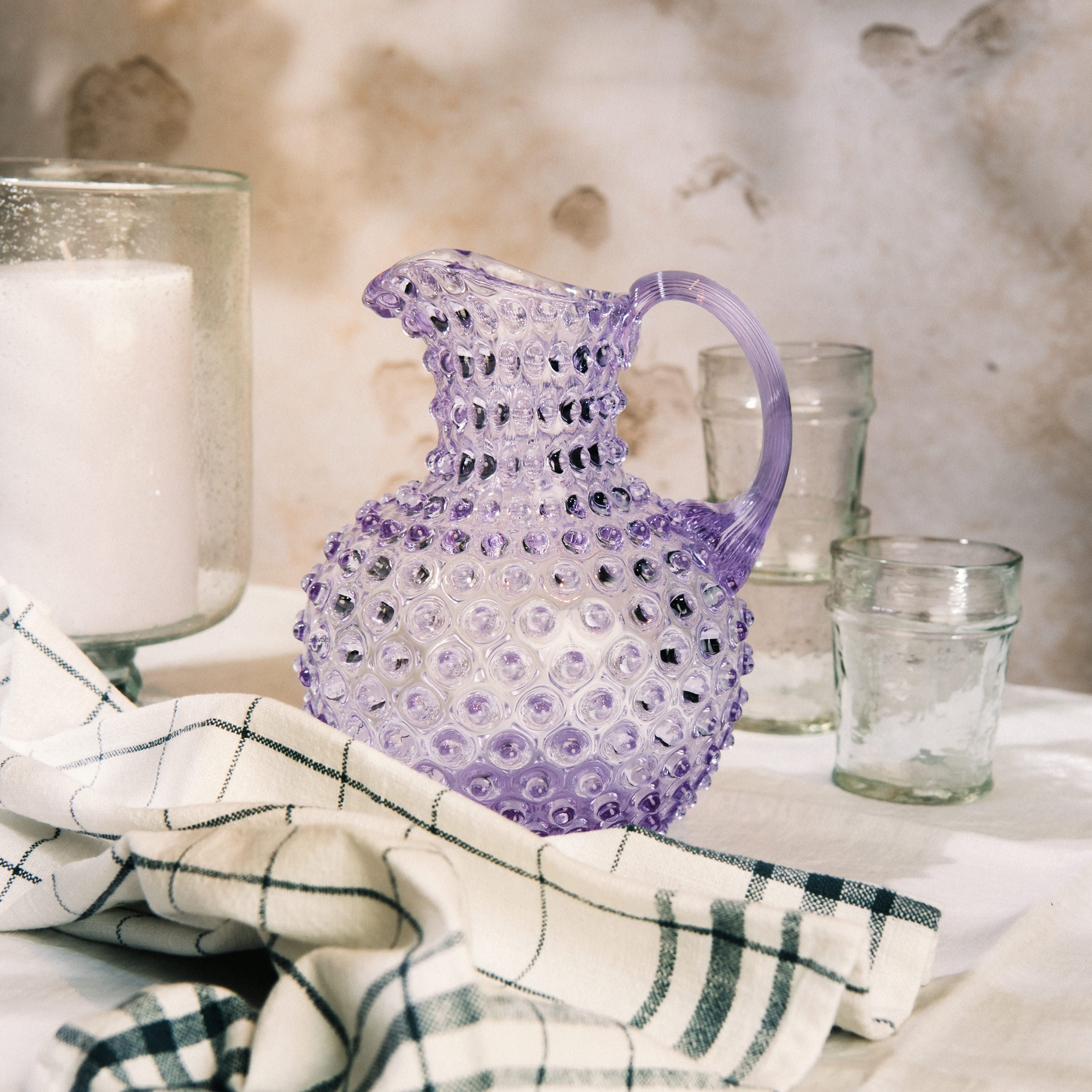 Hobnail Glass Pitcher in Lilac Bloom on a table at Addison West