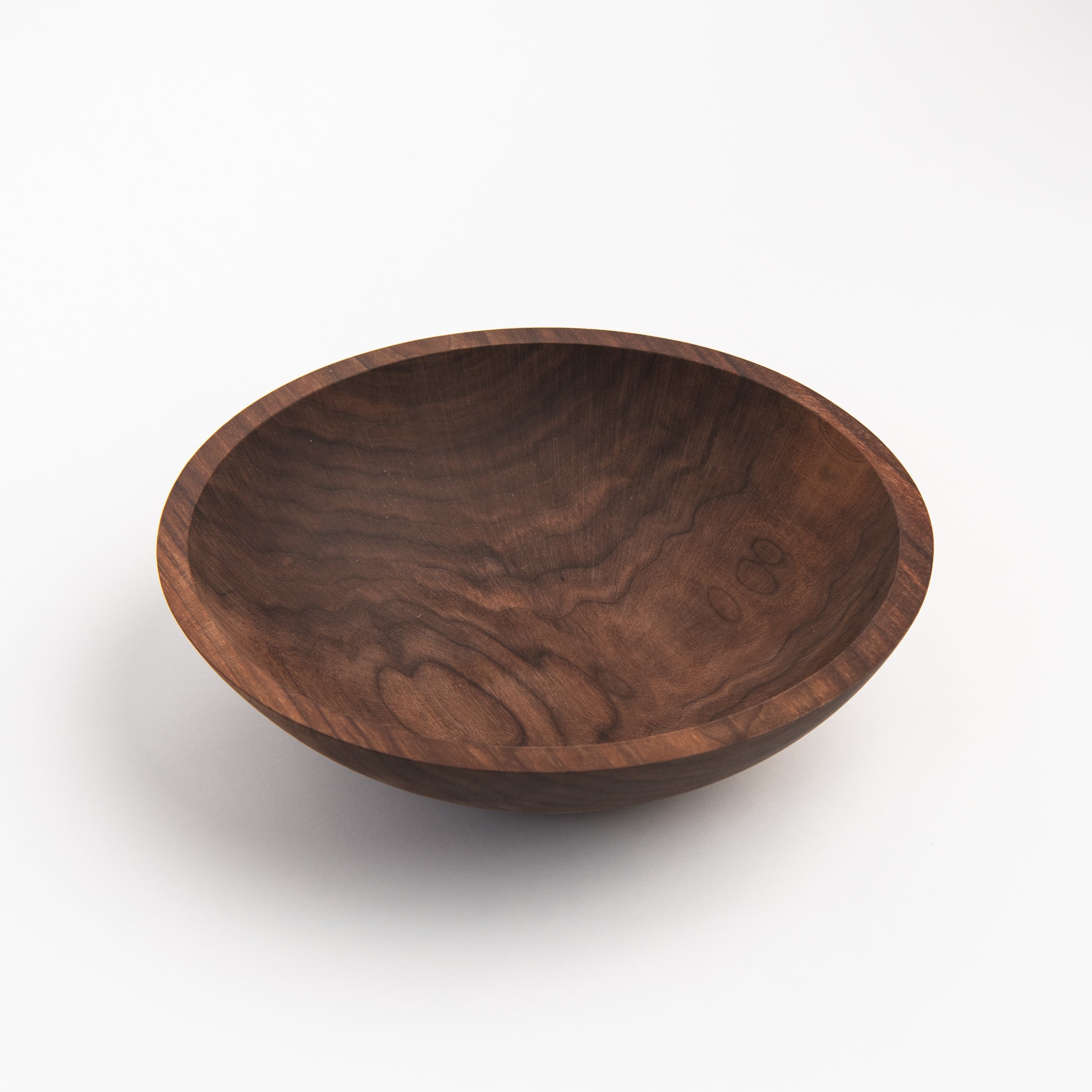 Legacy Bowl in Walnut on a white background at Addison West