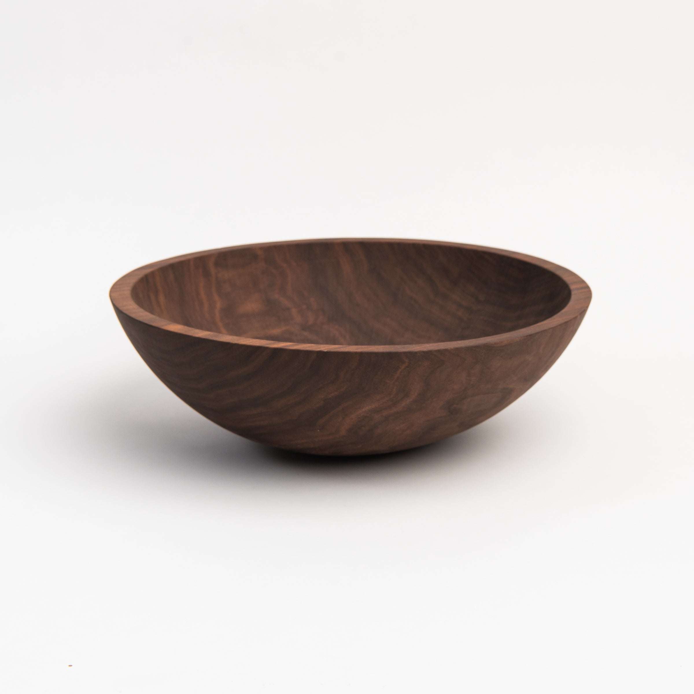 Legacy Bowl in Walnut on a white background at Addison West