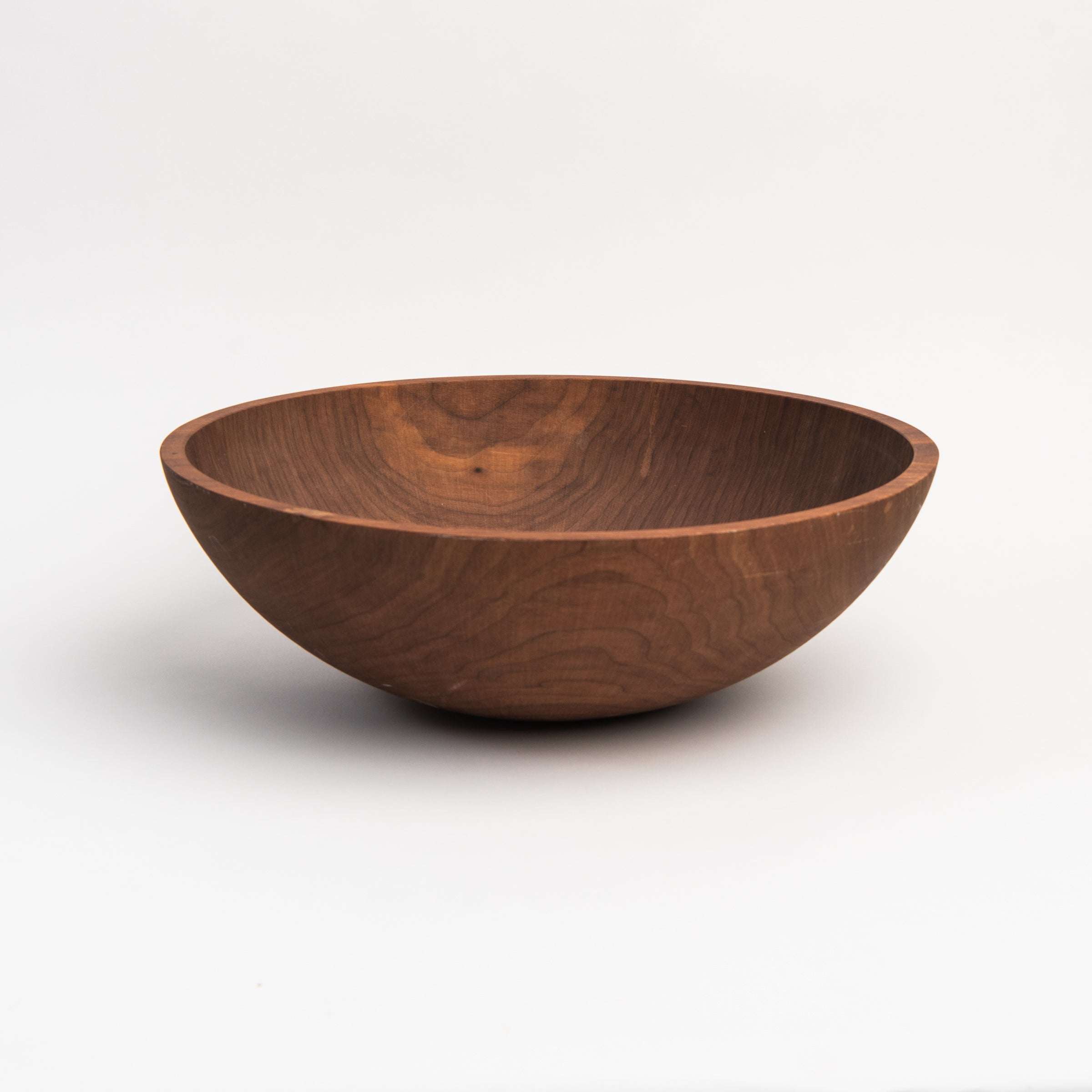 Legacy Bowl in Walnut on a white background at Addison West
