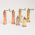 Alexander Mills Copper and Brass Salt and Pepper Mills on a white background at Addison West