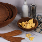 Legacy Bowl in Cherry on a kitchen counter at Addison West