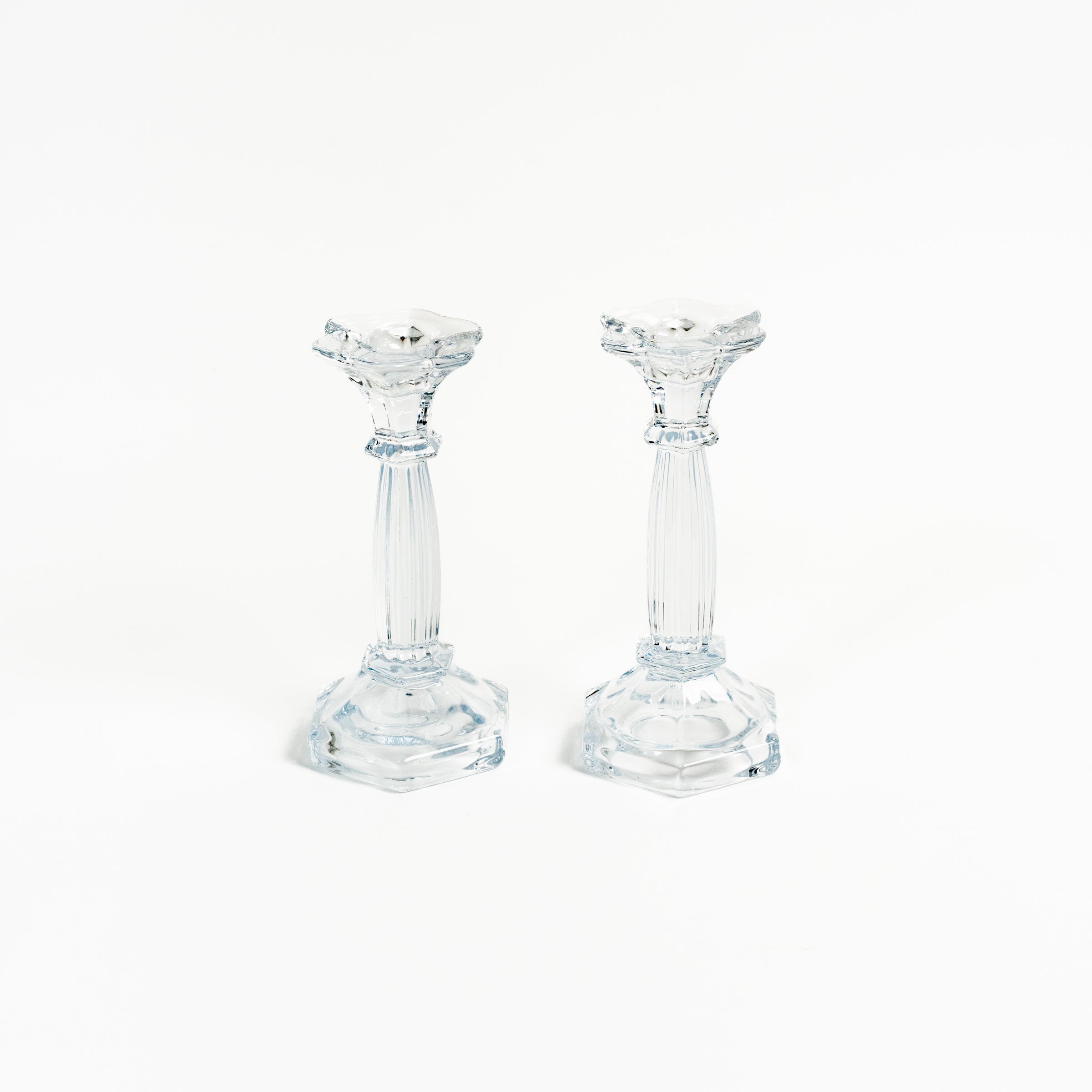 Vintage Pair Glass Candlesticks on a white background at Addison West