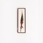 Feather pen on a white background at Addison West