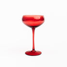 Cheers to You in Red champagne glass on a white background at Addison West