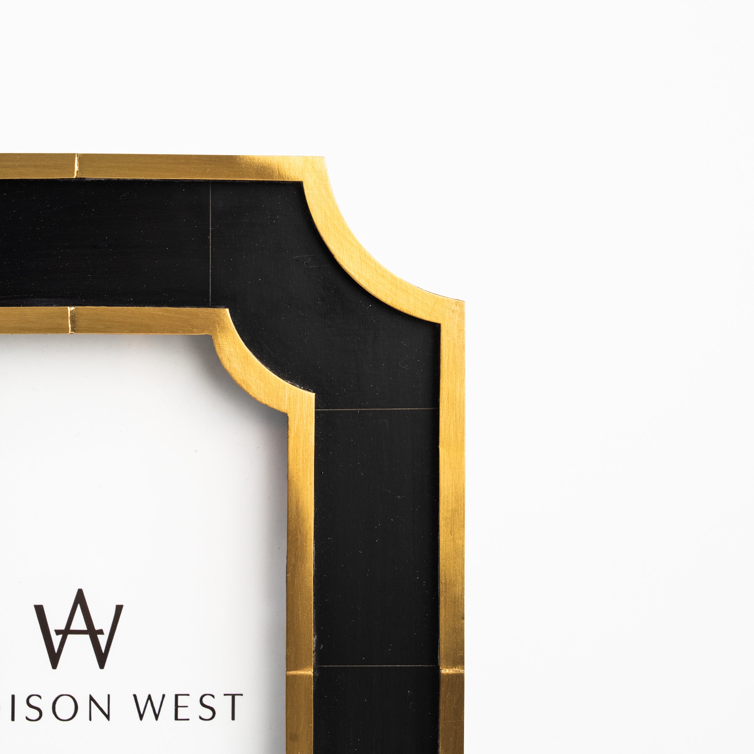 Close up of Marbled Resin & Brass Frame on a white background at Addison West