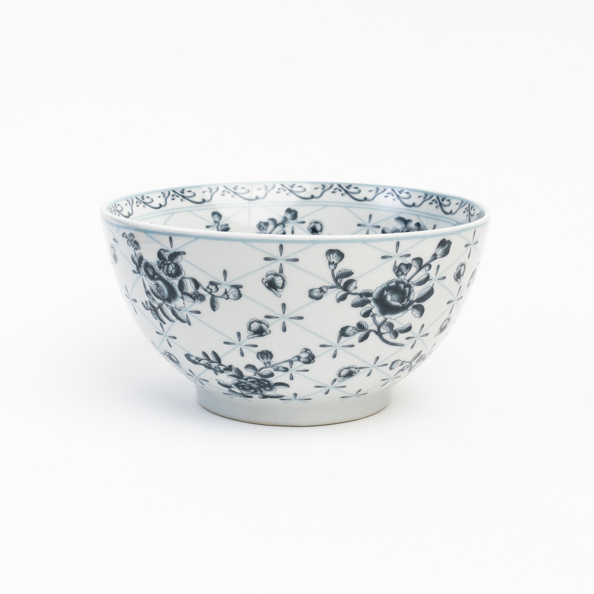 Meadow Porcelain Bowl with blue and white flowers on a white background at Addison West