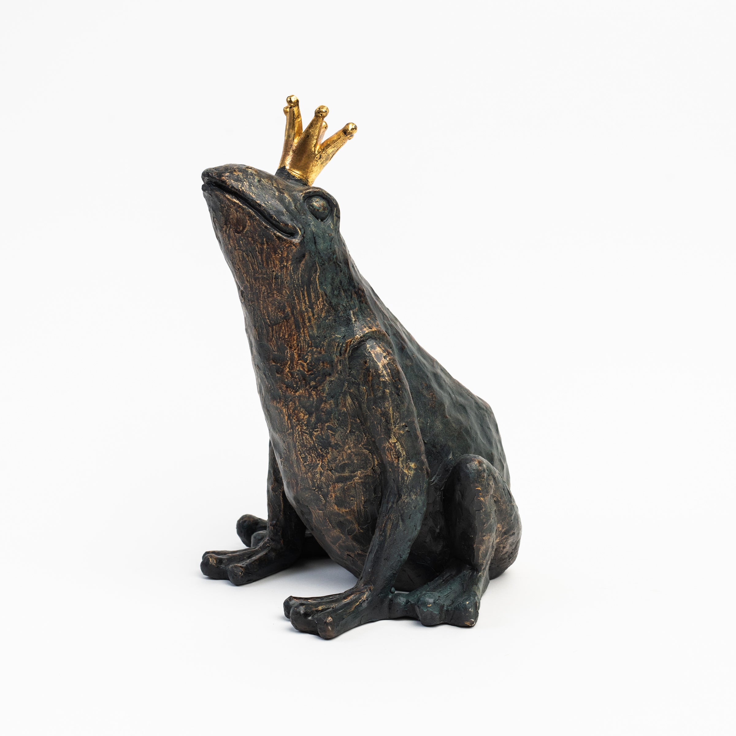Patinaed Frog Prince on a white background at Addison West