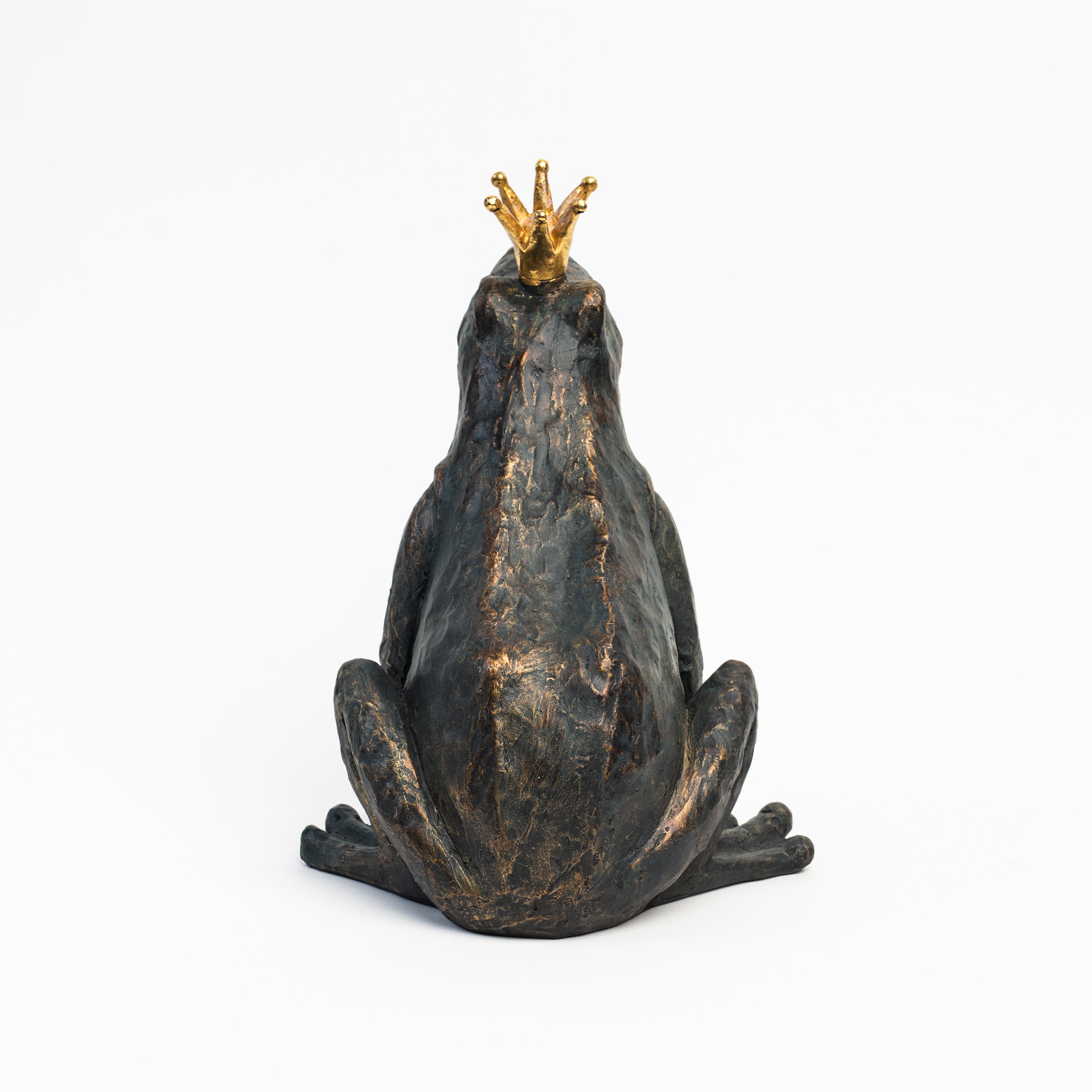 Patinaed Frog Prince on a white background at Addison West