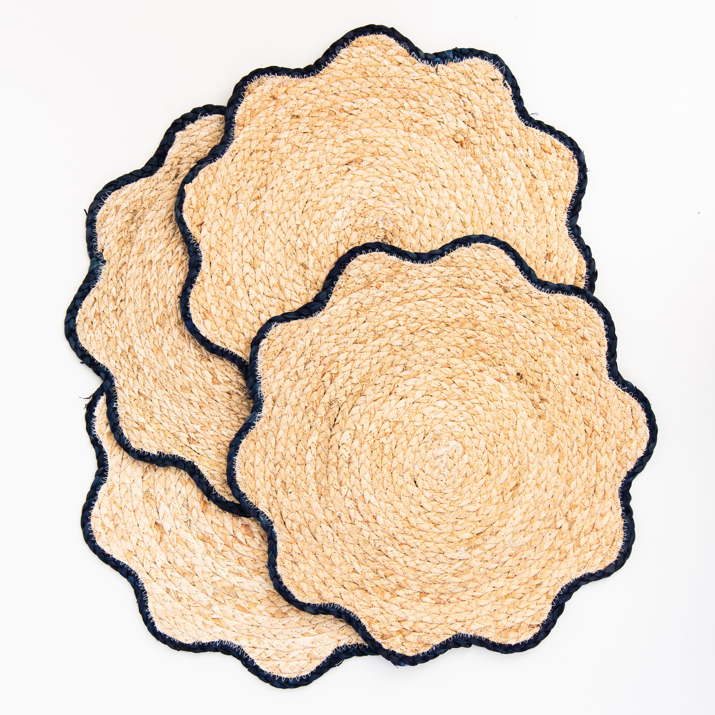 Handwoven Scalloped Edge Placemats on a white background at Addison West