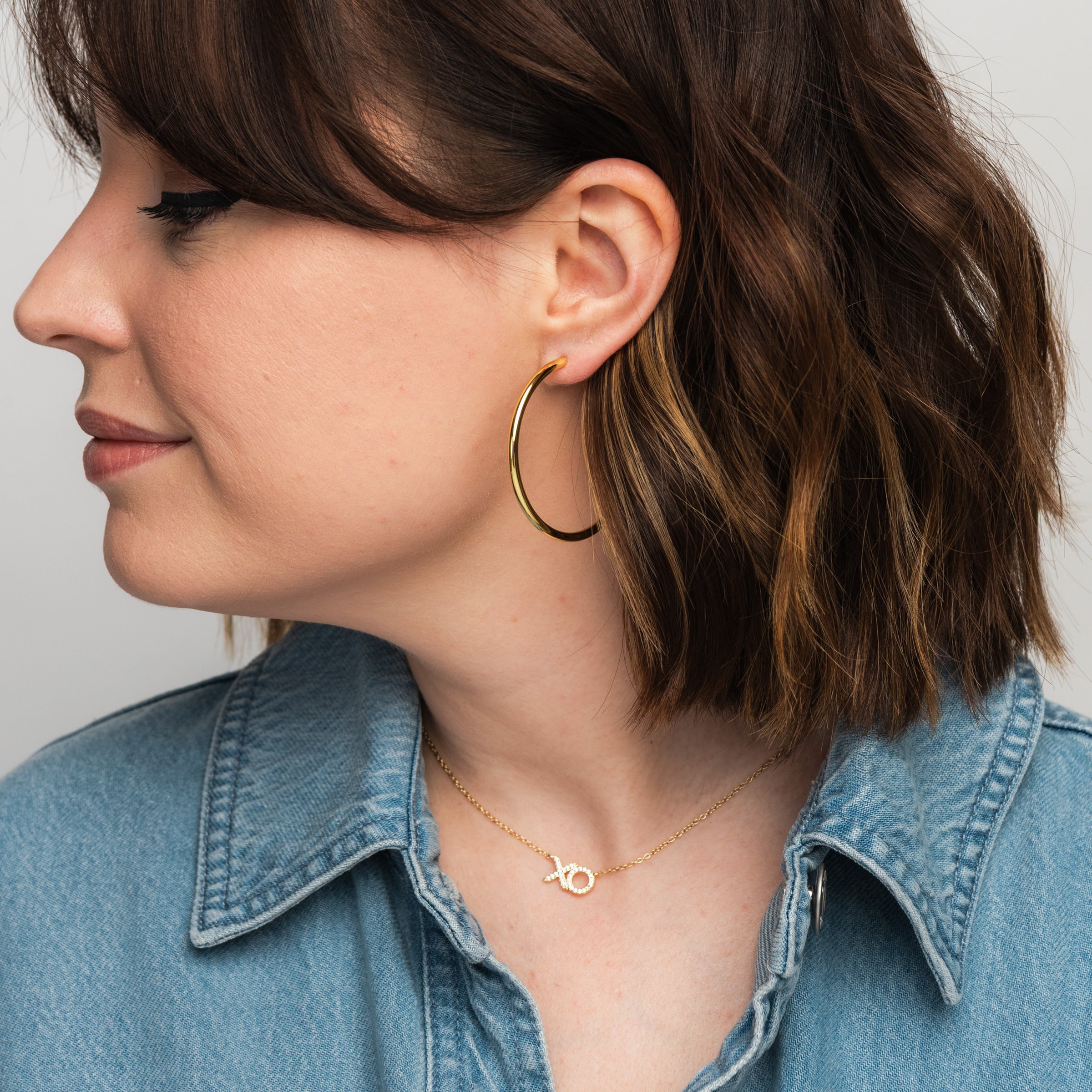 Elli Parr Classic Gold Hoops on a model at Addison West