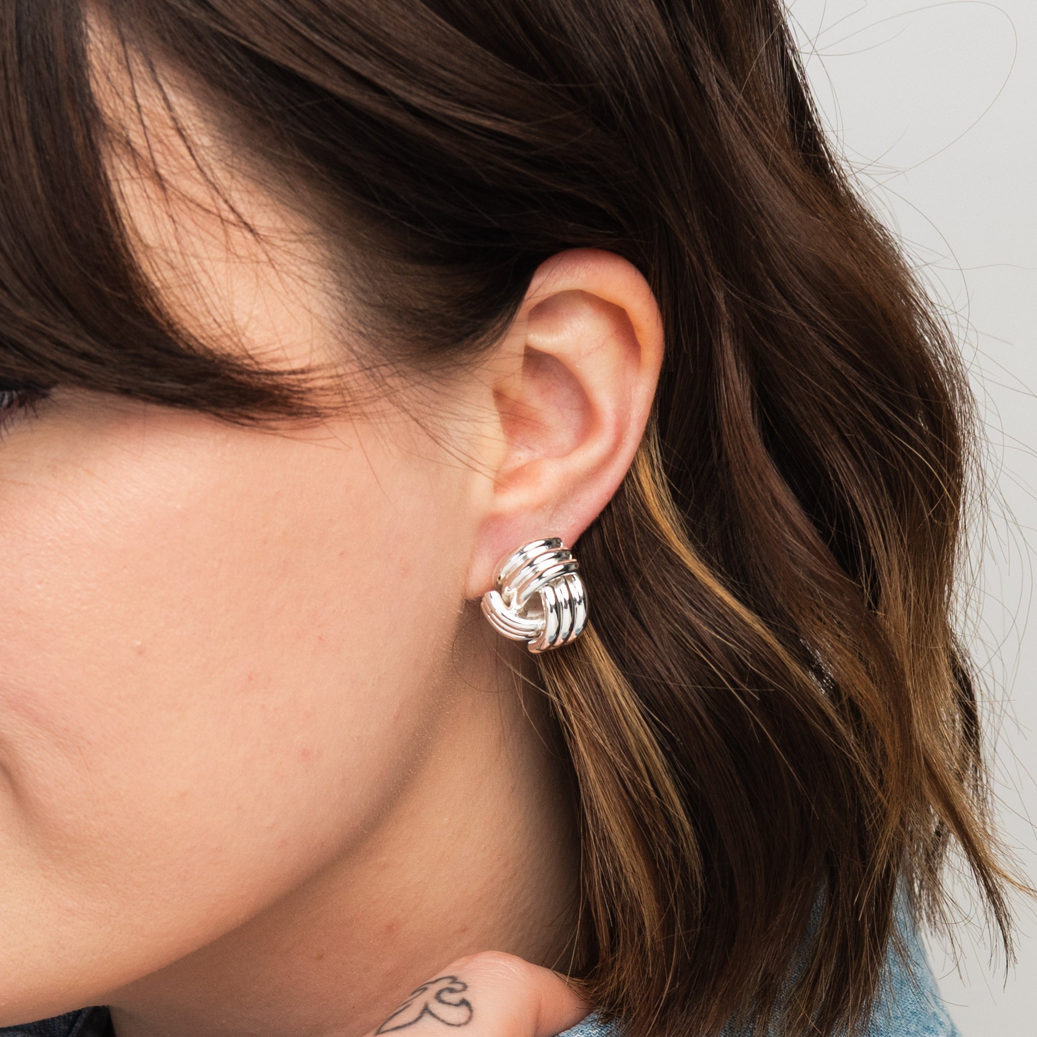 Elli Parr Knotted Stud in Silver on a model at Addison West