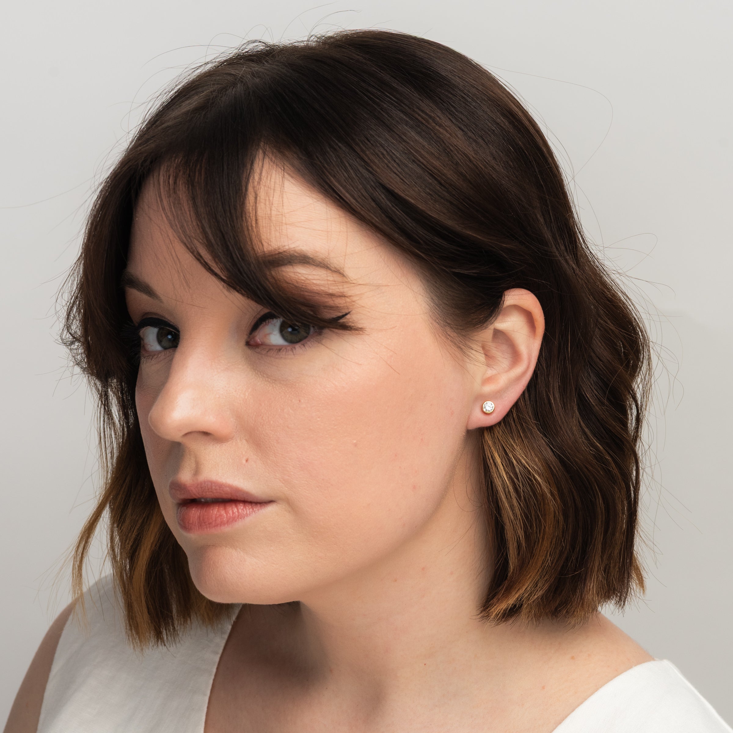 Elli Parr Bezel Simulated Diamond Studs on a model at Addison West