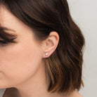 Elli Parr Bezel Simulated Diamond Studs on a model at Addison West