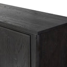 Close up of Amber Lewis x Four Hands Bari Bar Cabinet in Cracked Smoked Black Veneer on a white background at Addison West