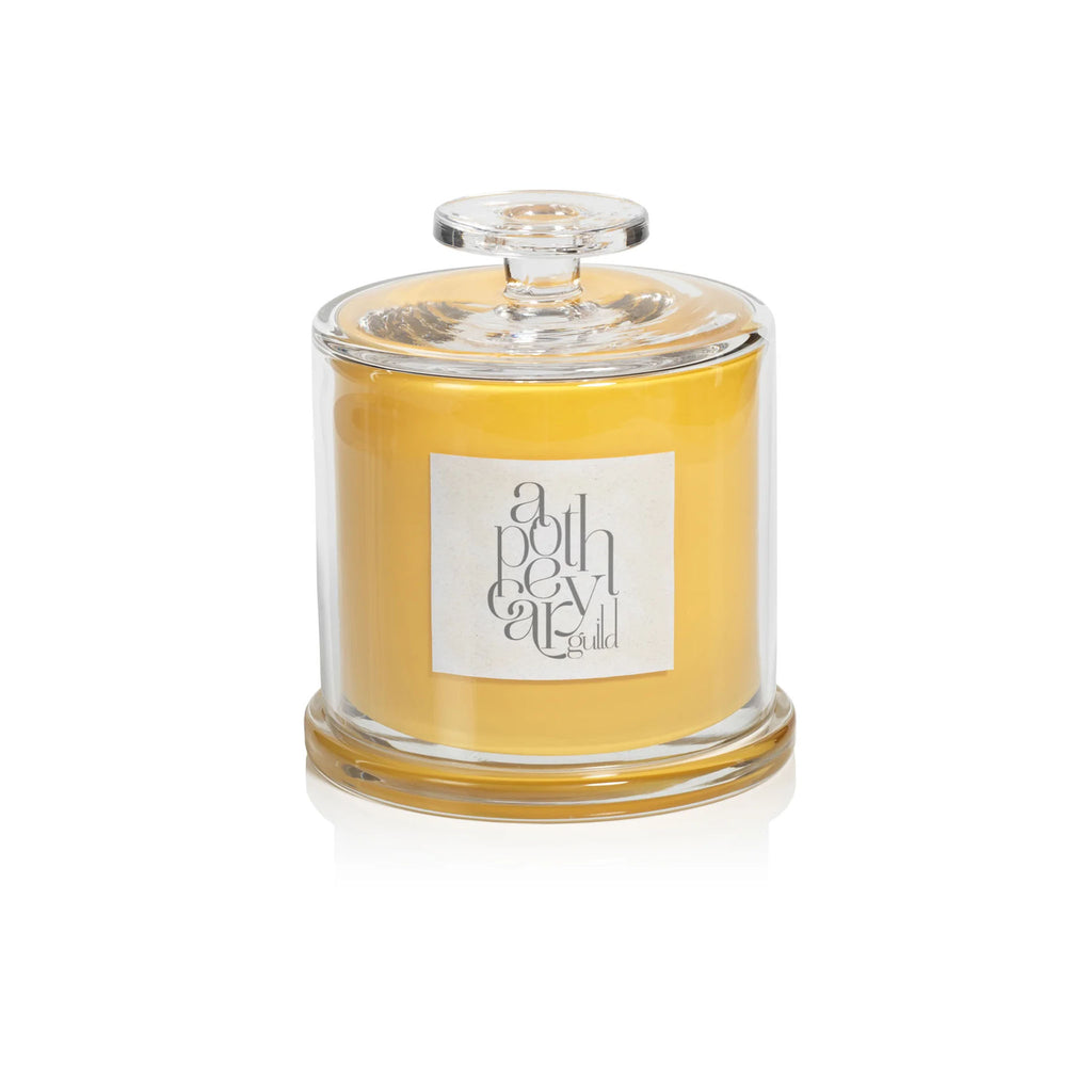 Apothecary guild grapefruit juniper cloche candle on a white background