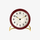 Arne Jacobsen Station Table Clock in Bordeaux on a white background