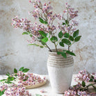 Abigail Ahern Faux Japanese Cherry in Blush in a vase on a beige background at Addison West