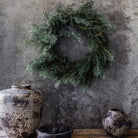 Abigail Ahern Artificial Juniper Wreath on a grey background at Addison West