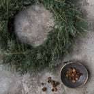 Abigail Ahern Artificial Juniper Wreath on a grey background at Addison West