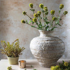 Abigail Ahern Faux Scabiosa in a vase on a beige background at Addison West
