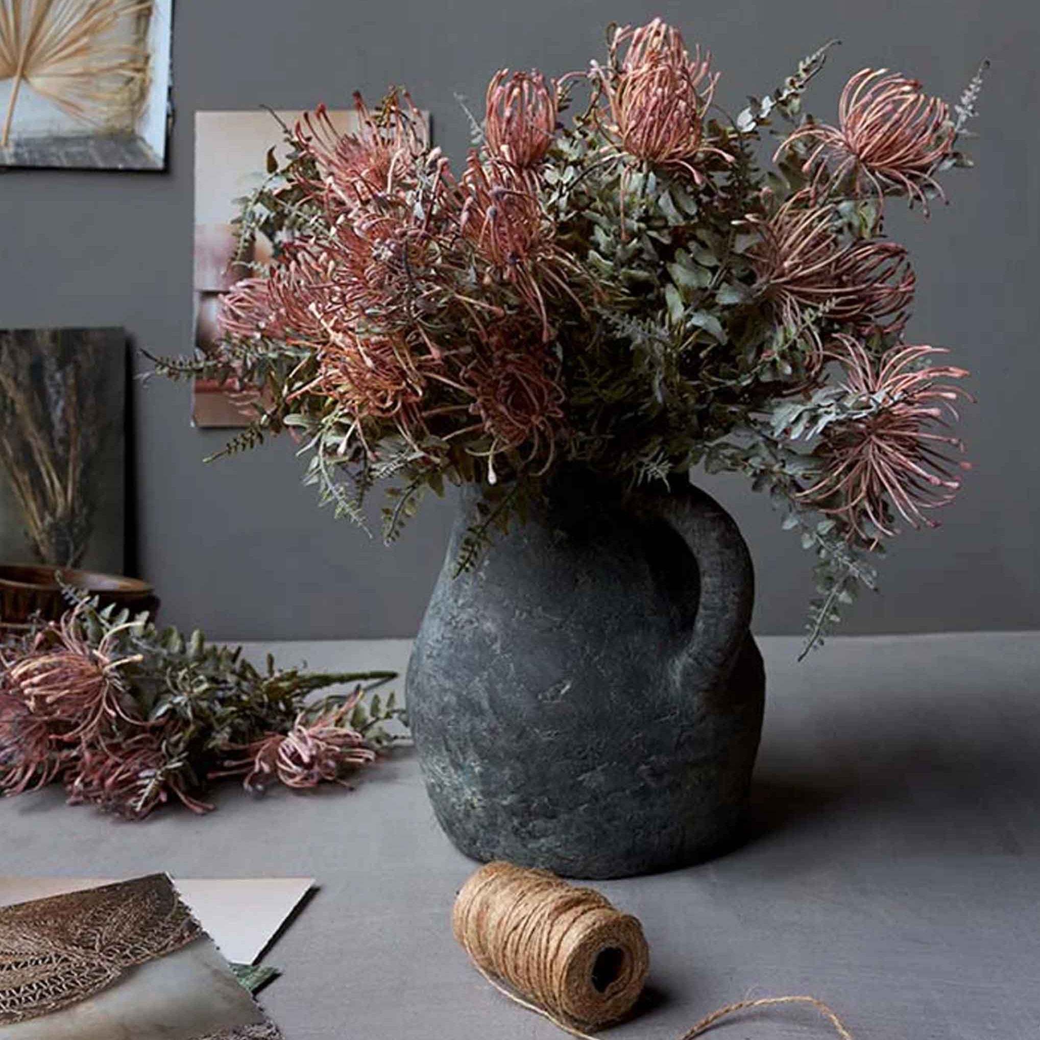 Abigail Ahern Faux Leucospermum Bush in a grey vase at Addison West