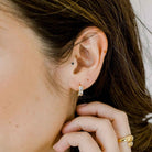 Elli Parr Asher Huggies in Gold on a model at Addison West