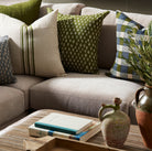 Astra Green 22" Square Pillow on a sofa at Addison West
