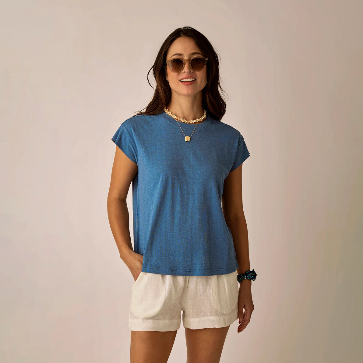 Astrid Hemp Tee in Captain shown on model on plain background.