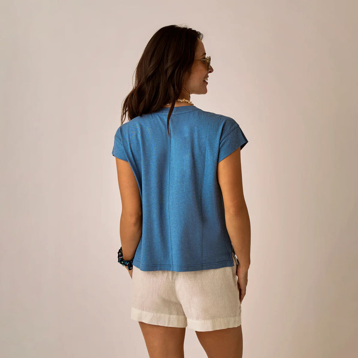 Astrid Hemp Tee in Captain shown on model on plain background.