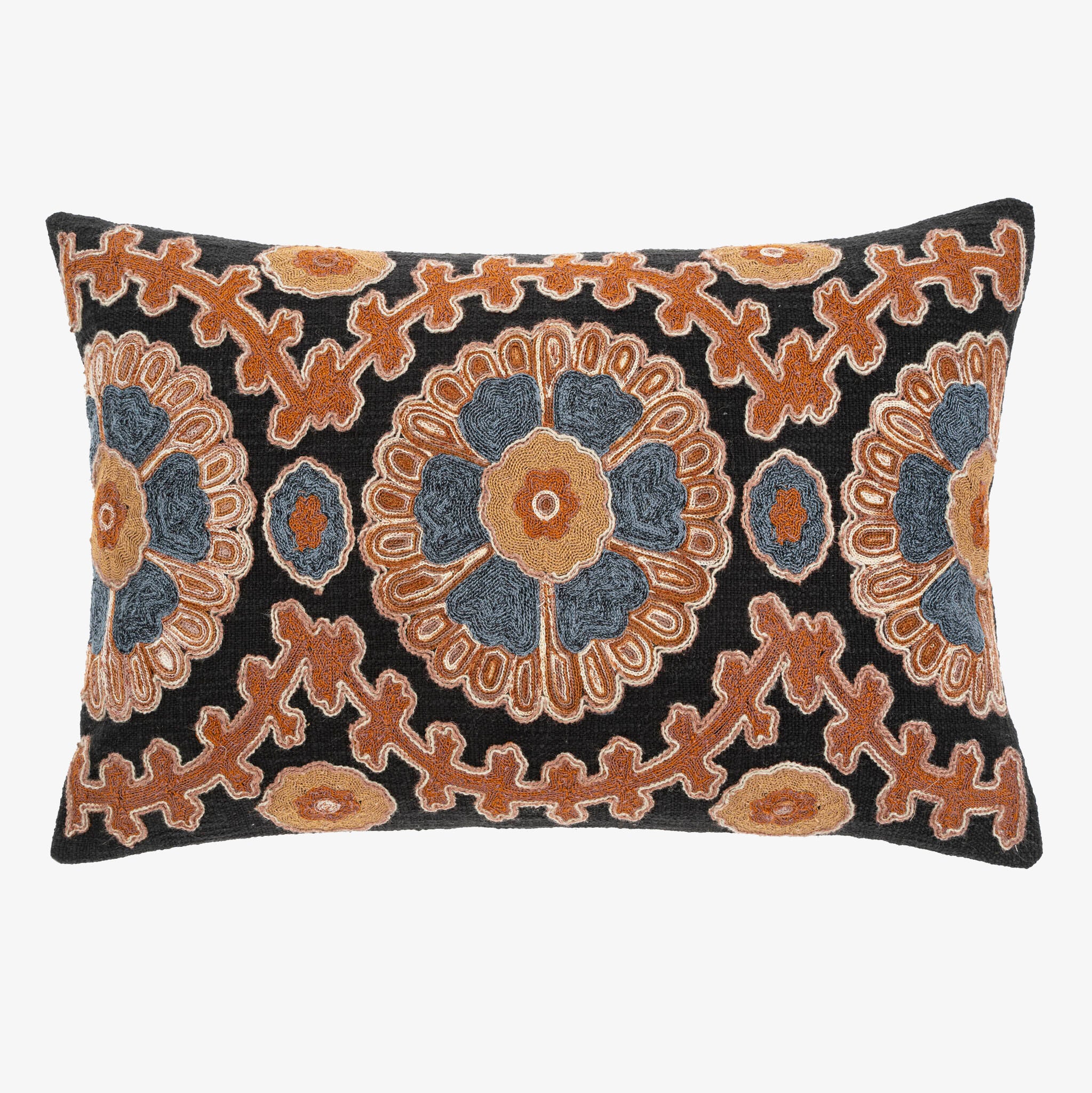 Azul Suzani Pillow on a white background with blue and rust stitching 