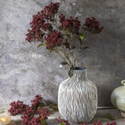Abigail Ahern Faux Butterfly Bush in Rouge on a grey background at Addison West