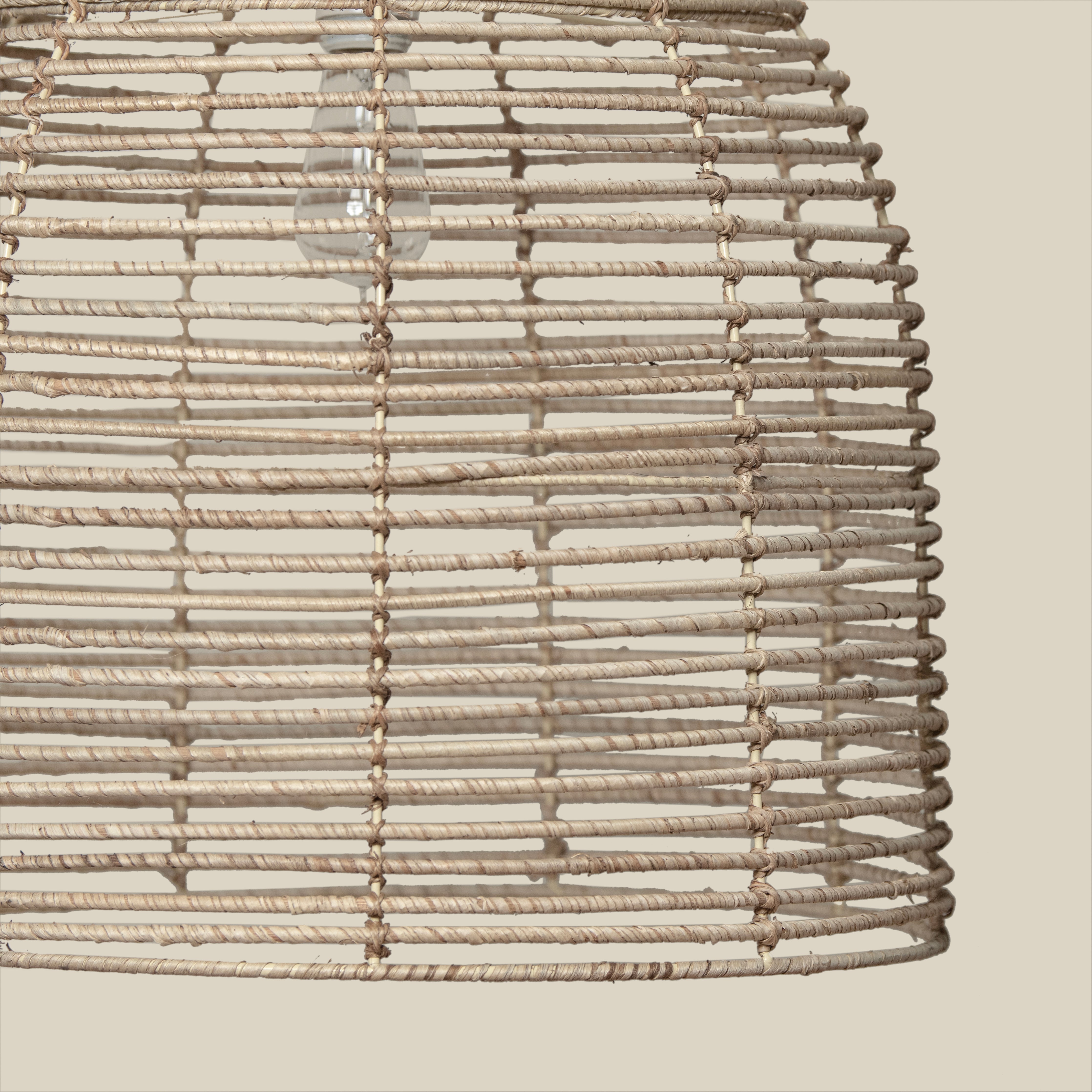 Close up of Beehive Chandelier on a beige background at Addison West