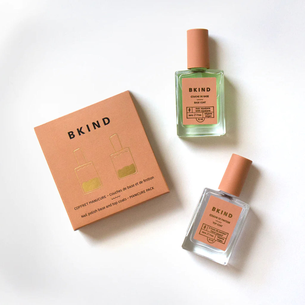 BKIND manicure set box with base coat and top coat bottles on a white background