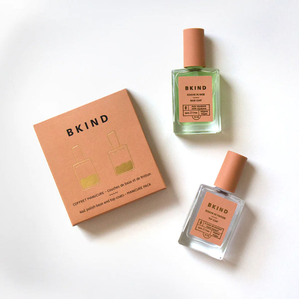 BKIND manicure set box with base coat and top coat bottles on a white background