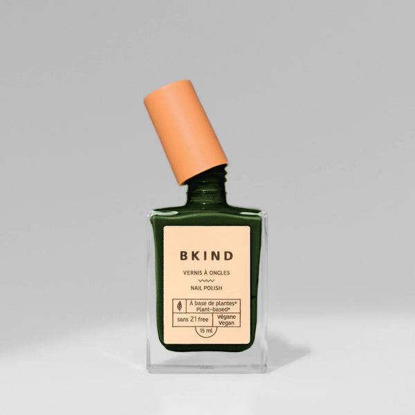BKIND Nail Polish in En Beau Fusil dark green on a great background