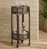 Texxture brand round bamboo bar cart on a wood floor with seagrass wallpaper behind