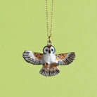 Barn Owl Necklace on a green background at Addison West