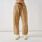Aaron and Amber Tan barrel jeans  worn by a person on a white background