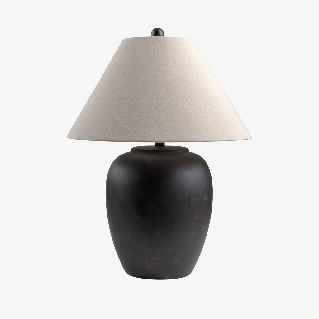 Black surya Bastille table lamp with flared white linen shade on a white background