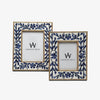 Two picture frames with floral bone navy blue inlay on a white background 