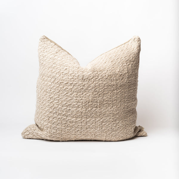 Neutral woven 24 inch by 24 inch pillow with down insert on a white backrgound