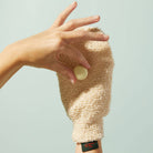 The Body Mitt on a green background at Addison West